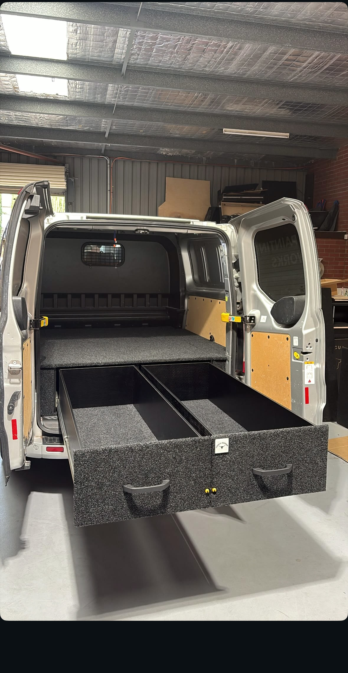 Silver work van fit-out with the twin drawers slid out